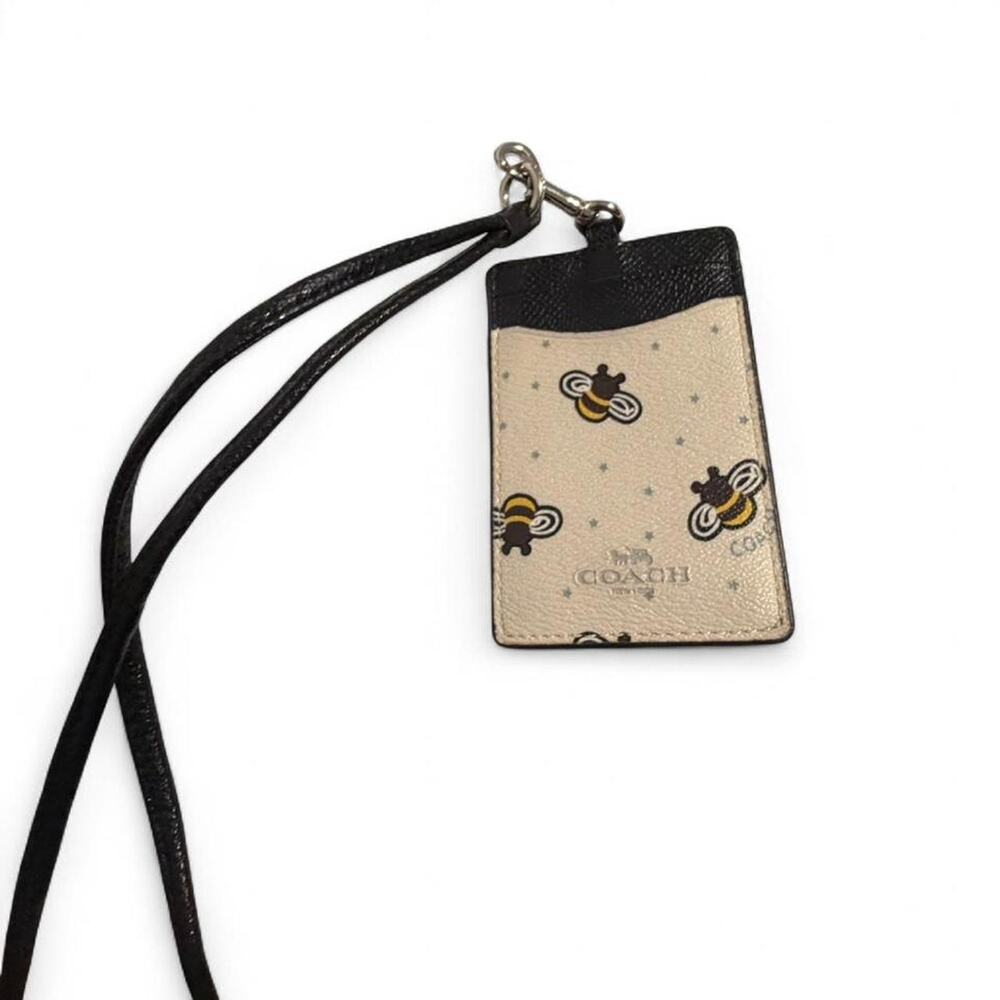 Here's the listing:  Coach Bee Card Holder with Lanyard